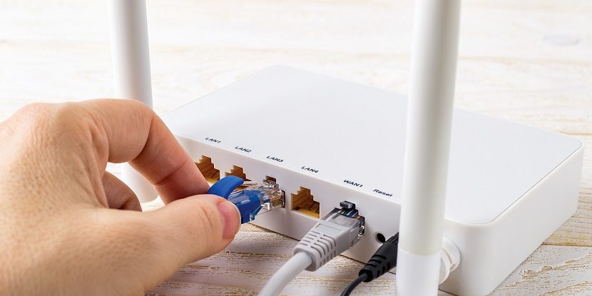 Woman-plugging-in-DSL-line_830x415-830x415-c-default.jpg